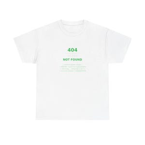 May include: A white short-sleeve t-shirt featuring green text that reads 404 SLEEP NOT FOUND, followed by smaller white text including searching for sleep, ERROR: resource unavailable, retrying attempt 1 of 4, and current status = EXHAUSTED.