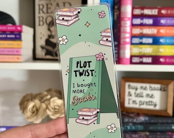 Marcapáginas "Giro argumental: Compré más libros", regalo para amantes de la lectura.