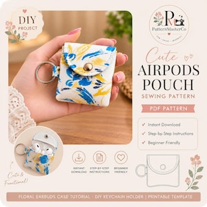 Peut inclure: Une petite pochette en tissu pour écouteurs avec une base blanche et un motif floral abstrait bleu et jaune, une fermeture à pression en métal et un anneau porte-clés argenté. La pochette est présentée fermée et ouverte avec des écouteurs blancs.