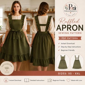 May include: A dark olive green pinafore apron with ruffled shoulder straps, a waist tie, and a bottom ruffle. The apron is shown from the front and back over a cream-colored blouse. Text includes Ruffled Apron Sewing Pattern and sizes XS-XXL.