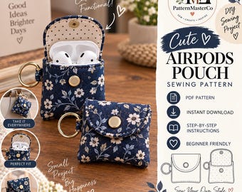 Può includere: Una custodia in tessuto blu navy con motivo floreale bianco, progettata per contenere auricolari wireless. La custodia presenta una chiusura a scatto in metallo dorato e un portachiavi abbinato. L'interno è foderato in tessuto color crema con piccoli pois neri.