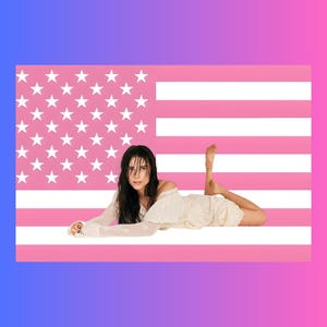 May include: A person with dark hair wearing a long-sleeved white top lying down in front of a pink and white American flag graphic. The flag features a field of white stars on a pink background with alternating horizontal pink and white stripes.