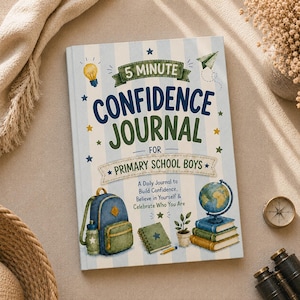 May include: A hardcover book titled 5 Minute Confidence Journal for Primary School Boys with a light blue and white striped cover. The cover features illustrations of a backpack, a globe on books, a small plant, and a lightbulb with text.