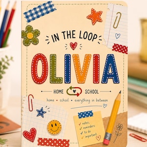 May include: A notebook with a cream cover featuring the name OLIVIA in colorful stitched letters. The design includes illustrations of a yellow pencil, paper scraps, a smiley face, stars, hearts, and text reading IN THE LOOP and home school everything in between.
