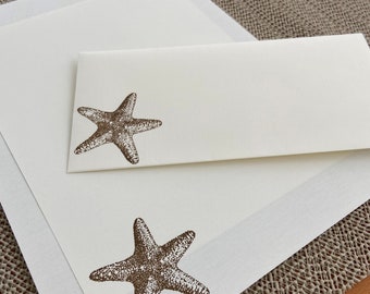 Hand made stationery set, writing paper stamped with starfish and seashells on creamy off-white writing paper, 30 pieces.