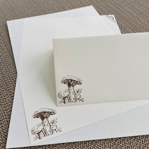 Hand made stationery set, writing paper stamped with mushrooms and flowers on creamy off-white writing paper, set of 30 pieces.