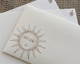 Hand made stationery set, writing paper with a mystic sun stamped on creamy, off-white writing paper, set of 30 pieces.