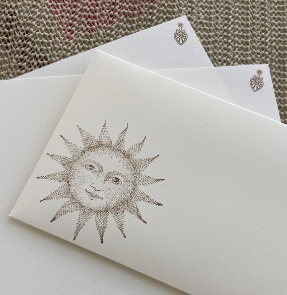 Hand made stationery set, writing paper with a mystic sun stamped on creamy, off-white writing paper, set of 30 pieces.