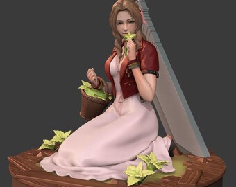 May include: A figurine of a character with brown hair, wearing a red jacket over a long light pink dress, kneeling on a wooden platform. The character holds a small green flower and a brown basket of leaves, with a large grey sword resting behind them.