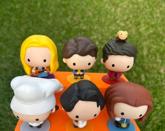 Display stand for Friends mini toys, McDonald's promotional items.