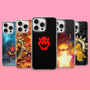 Könnte beinhalten: Fünf Smartphone-Hüllen mit verschiedenen Bowser-Charakterdesigns. Eine Hülle ist schwarz mit einem roten Bowser-Emblem, während die anderen farbenfrohe Illustrationen von Bowser in verschiedenen Szenen zeigen, darunter eine mit einem leuchtenden Stern und eine mit Blitzen.