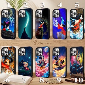 May include: Ten smartphone cases featuring various Disney character illustrations, including Mickey Mouse in Fantasia, fireworks, starry night skies, and colorful clouds. Each case has a black frame and a camera cutout, numbered one through ten.