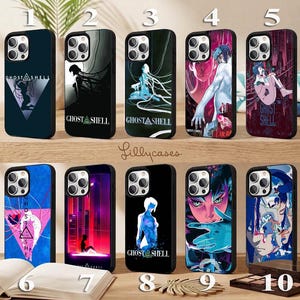 May include: Ten smartphone cases featuring Ghost in the Shell artwork. Each case displays unique character illustrations, cyberpunk cityscapes, or abstract designs with the Ghost in the Shell logo. The cases are arranged in two rows of five.
