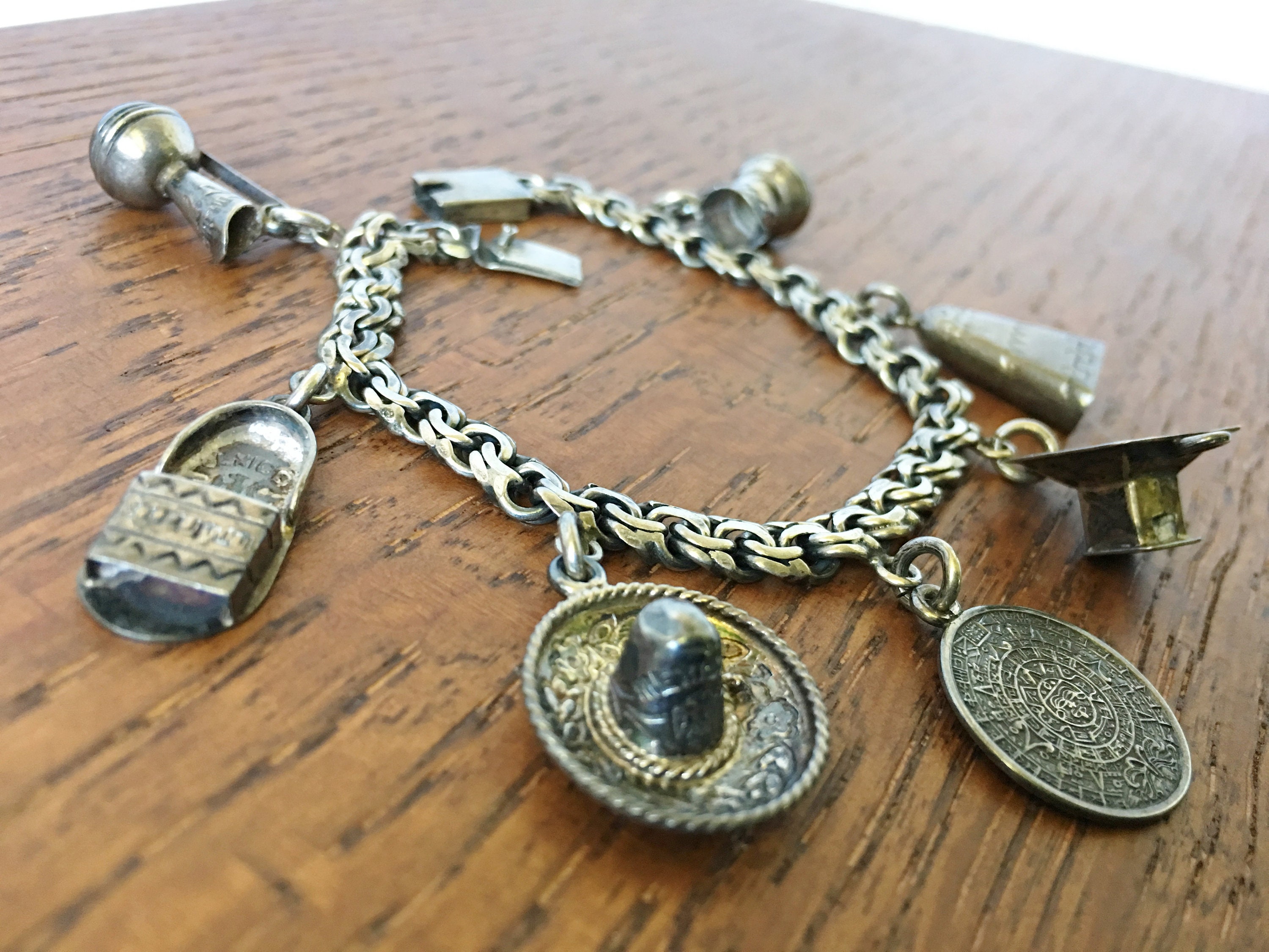 Sold at Auction: MEXICAN STERLING SILVER CHARM BRACELET