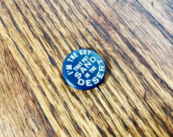 OBAK CIGARETTES Im the guy that put sand in the desert Vintage Pin Blue Button