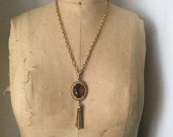 Vintage Avon gold with amethyst glass pendant and tassel necklace.