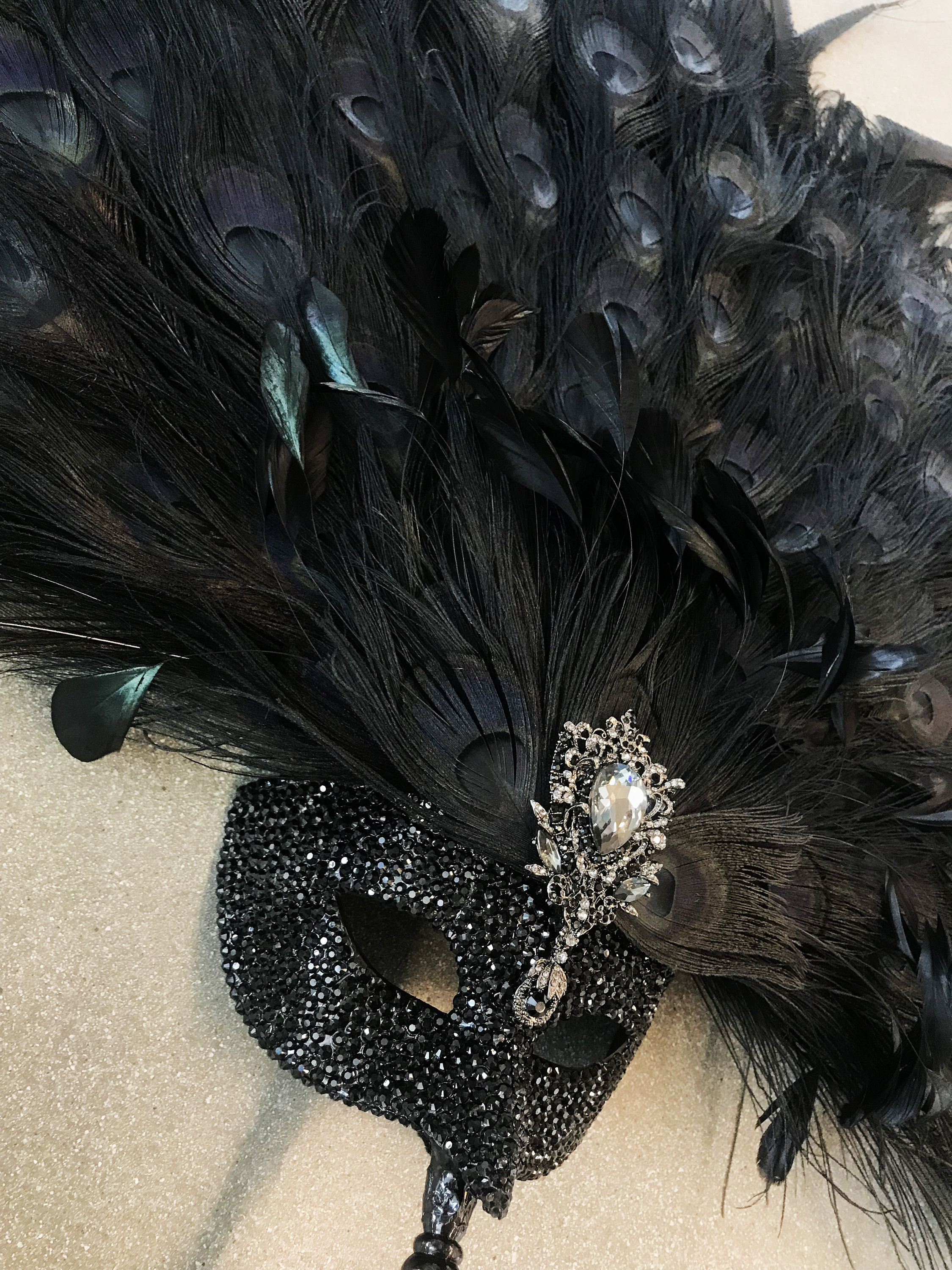 Obsidian Opulence Handled Peacock Feather & Rhinestone Masquerade Mask ...