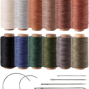 May include: Twelve spools of waxed thread in a variety of colors including cream, gray, brown, black, blue, green, and olive, arranged in two rows. Below the thread are two curved needles and five straight needles of varying lengths and thicknesses.