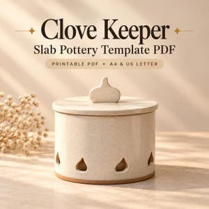 May include: A cream-colored ceramic clove keeper with a speckled finish, a flat lid featuring a central handle, and teardrop-shaped cutouts along the base. The text reads Clove Keeper Slab Pottery Template PDF, Printable PDF, A4 & US Letter.