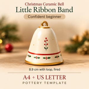May include: A cream-colored ceramic bell with a gold-toned top loop and base rim. The bell features a painted red berry and green leaf motif, a horizontal red stripe, and small gold stars. Text includes Christmas Ceramic Bell, Little Ribbon Band, Confident beginner, 8.9 cm with loop, fired, and A4 + US LETTER POTTERY TEMPLATE.