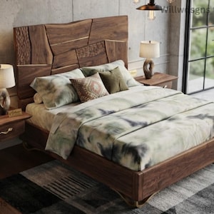 May include: A wooden bed frame with a headboard composed of irregular, textured walnut panels. The bed is dressed in a light-coloured bedding set with a muted green and grey abstract pattern, featuring two square throw pillows and two rectangular pillows.