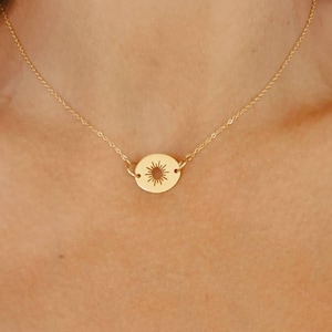 The star burst necklace, thin gold stainless steel chain with oval cutout star pendant