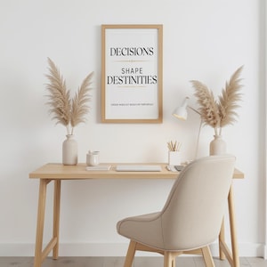 May include: A rectangular wooden frame containing a white print with the black text DECISIONS SHAPE DESTINITIES and the smaller text CHOOSE WISELY ACT BOLDLY LIVE PURPOSEFULLY, displayed on a wall above a wooden desk with a chair and decor.