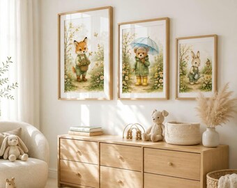May include: Three framed wall art prints featuring watercolor illustrations of a fox holding a basket, a bear holding a blue umbrella, and a rabbit holding a watering can, all set in a garden scene with yellow flowers and light green foliage.