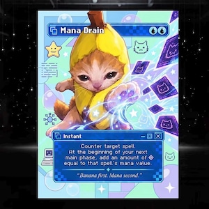May include: A rectangular trading card featuring a brown kitten wearing a yellow banana costume. The card displays the text Mana Drain, Instant, and game rules, with blue and purple digital graphics, pixelated icons, and a light blue background.