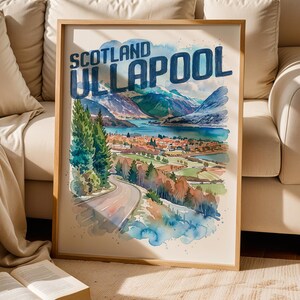 May include: A framed watercolor-style art print featuring a landscape of Ullapool, Scotland. The image depicts a winding road leading toward a coastal town, surrounded by green trees, mountains, and a blue body of water. The text reads SCOTLAND ULLAPOOL.
