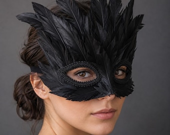 May include: A black masquerade mask adorned with layered black feathers extending upwards and outwards. The eye openings are framed with a decorative black braided trim, and the mask is secured with a simple black elastic strap around the head.