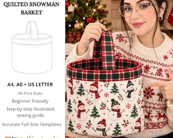 May include: A quilted fabric basket featuring a repeating pattern of snowmen, Christmas trees, and red snowflakes on a white background. The basket has a green and red plaid fabric trim and a matching plaid handle. Text includes PDF SEWING PATTERN.
