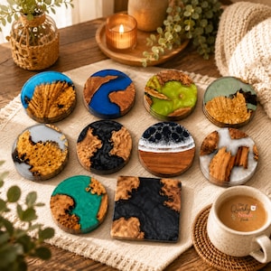 May include: A collection of ten coasters featuring a mix of natural wood burl and coloured resin. The set includes circular and square shapes with blue, green, black, white, and clear resin pours, some mimicking ocean waves or abstract patterns.