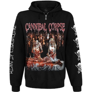 May include: A black zip-up hoodie featuring the Cannibal Corpse logo in red dripping text. The front graphic depicts two figures in white aprons over a table with a skeleton. The text "BUTCHERED AT BIRTH" is printed on the right sleeve.