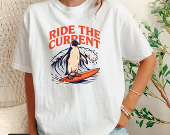 Surfing Penguin Shirt, Ride The Current Retro Surf Tee, Comfort Colors® Bird Nerd Shirt, Penguin Gift for Surfers, Beach Vacation Shirt