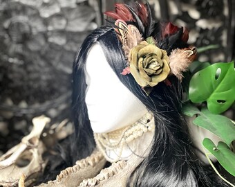 Velvety green rose flower with feather accents