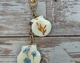 Decoupage seashell keychain/purse jewelry, orange wheat, blue flowers , gold chain.