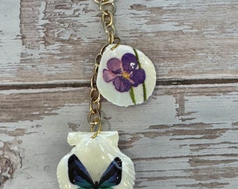 Decoupage seashell keychain/purse jewelry, purple flower, blue butterfly , gold chain.