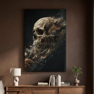 May include: A rectangular wall art print featuring a detailed, weathered human skull in profile. The skull appears to be disintegrating into dark smoke, embers, and small fragments against a deep black background, creating a high-contrast visual.