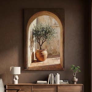 Op de afbeelding: Een rechthoekige wandkunstprint met een olieverfschilderij van een olijfboom in een terracotta pot, geplaatst in een stenen boog. De scène toont een zonnig terras met betegelde vloeren en gestructureerde muren in warme aardetinten.