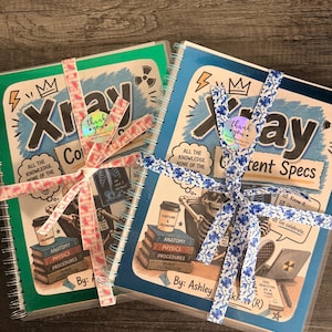 May include: Two spiral-bound notebooks titled Xray Content Specs with illustrated covers featuring a skeleton, books labeled Anatomy, Physics, Procedures, and Image Production, and text including All the knowledge. None of the boredom. Each is tied with patterned ribbon.