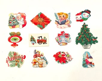 May include: A collection of vintage Christmas stickers featuring images of Santa Claus, angels, snowmen, poinsettias, a Christmas tree, a nativity scene, and a church. The stickers are printed on white paper with colorful illustrations.