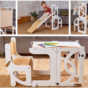 May include: A convertible white and natural wood learning tower that transforms into a desk and chair set. It features a slide, a chalkboard, a paper roll holder, and a fabric panel. The structure has cut-out circular patterns on the side panels.