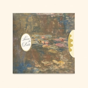 May include: A square card featuring an impressionistic water lily painting in shades of brown, blue, and pink. An oval cutout on the left displays the text Save the Date in black script. A small gold metal eyelet is centered with a scalloped edge.