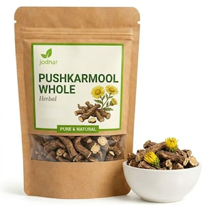 May include: A brown kraft paper stand-up pouch labeled PUSHKARMOOL WHOLE with a clear window showing dried brown herbal root pieces. A white bowl sits next to the pouch, filled with the same brown root pieces and two small yellow flowers.