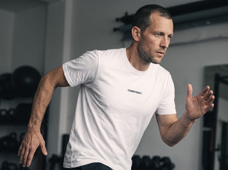 Embroidered Consistency Tee, Hybrid Athlete Gift, Made to Order (100% Cotton) afbeelding 1