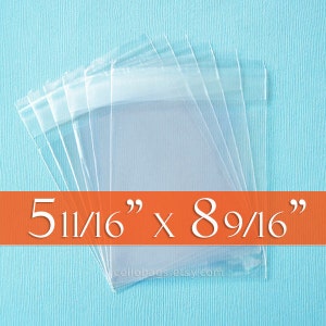 May include: Clear cellophane bags, measuring 5 11/16" x 8 9/16", are stacked against a light blue background. The bags are transparent and sealed at the top. The text "5 11/16" x 8 9/16"" is displayed on an orange banner.