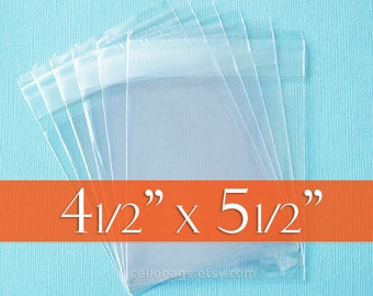 May include: Clear cellophane bags, 4.5" x 5.5", are stacked against a light blue background. The bags are transparent and have a sealed top. The text "4 1/2" x 5 1/2"" is displayed on an orange banner.
