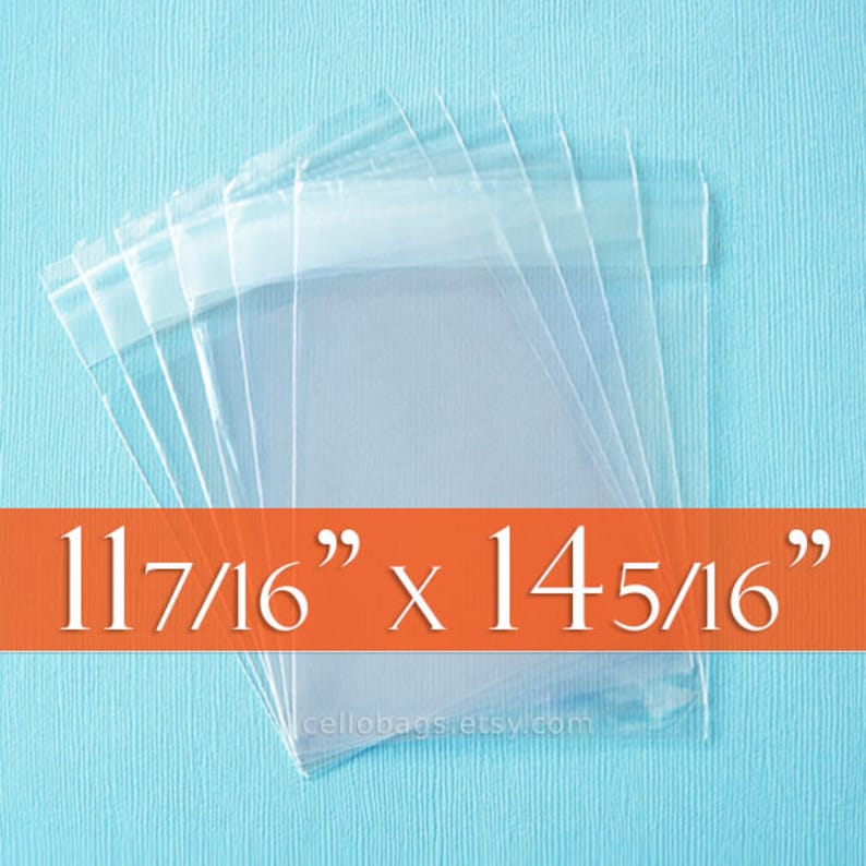 May include: Transparent cellophane bags arranged on a light blue backdrop. The bags are rectangular with a folded top. The text "11 7/16" x 14 5/16"" is displayed on an orange banner. The bags measure approximately 29.05 cm x 36.35 cm.