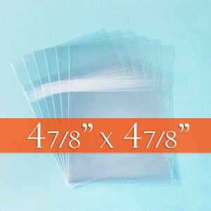 May include: Clear cellophane bags, stacked and fanned out, against a light blue background. The bags are approximately 4 7/8 inches by 4 7/8 inches. The text "4 7/8" x 4 7/8"" is displayed on an orange banner.